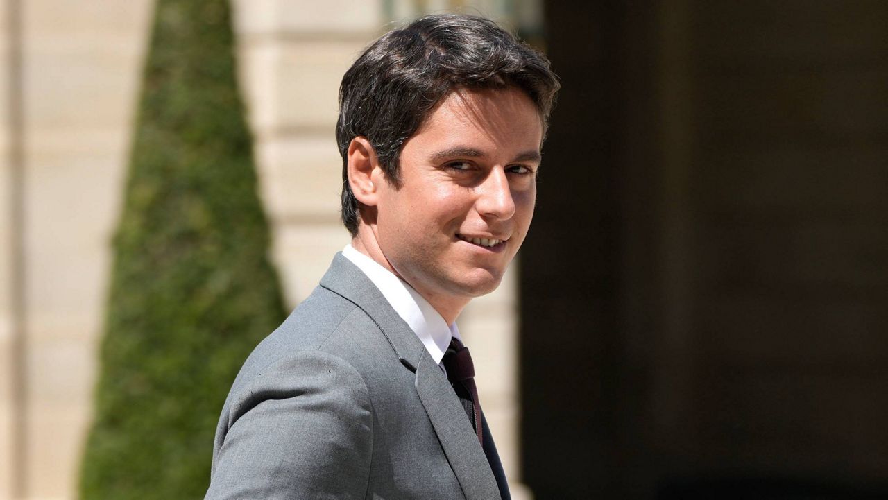 Government spokesperson Gabriel Attal walks out after the weekly cabinet meeting at the Elysee Palace in Paris, Wednesday, May 11, 2022. Attal was named France's prime minister Tuesday. (AP Photo/Francois Mori, File)