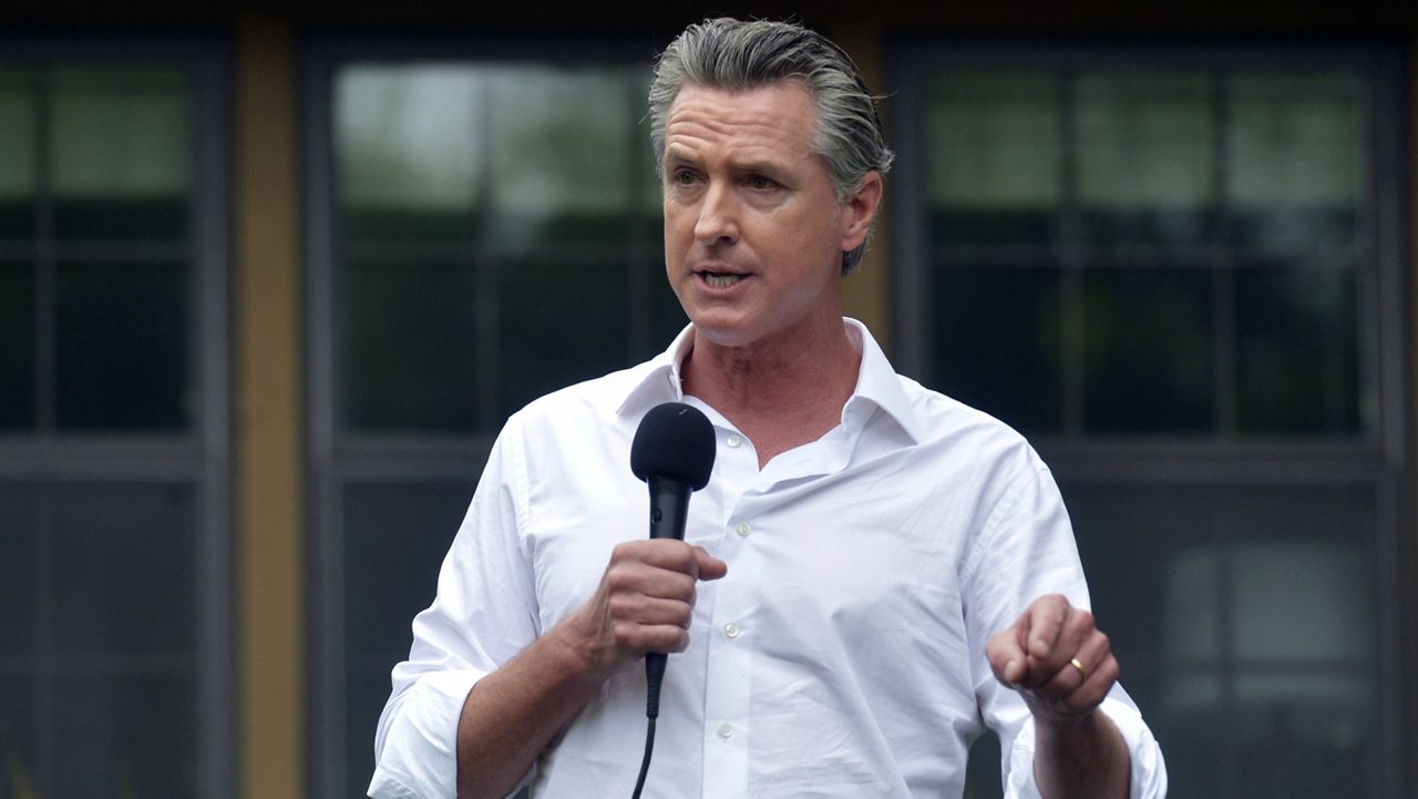 Gov. Gavin Newsom touts his support for President Joe Biden