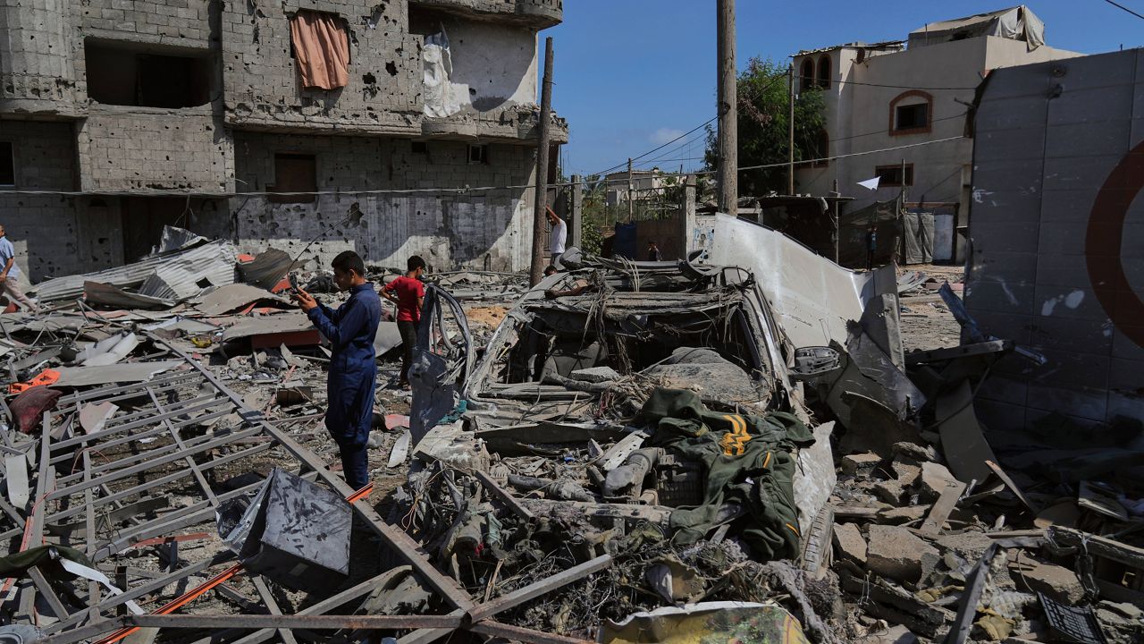 Palestinians inspect the wreckage of a gas station destroyed in an Israeli airstrike in Deir al-Balah, central Gaza Strip, Saturday, July 12, 2025. (AP Photo/Abdel Kareem Hana)