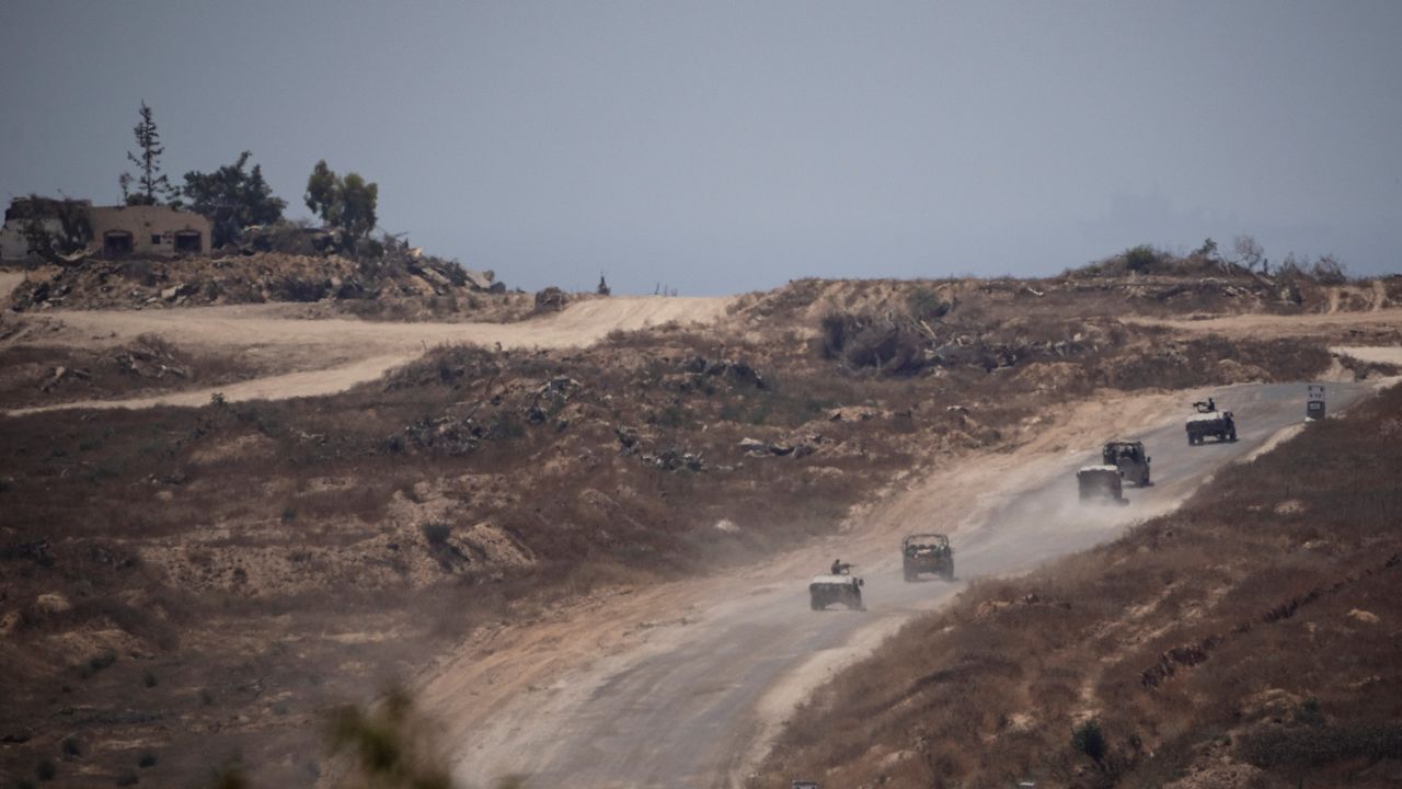 FILE - Israeli soldiers move near the Israeli-Gaza border as seen from southern Israel, Monday, June 10, 2024. (AP Photo/Leo Correa)