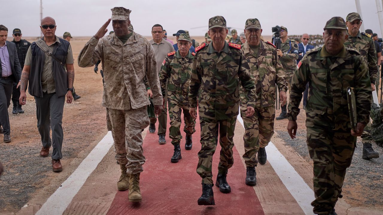 Gen. Michael Langley, USMC, Commander, U.S. Africa Command, center, and Major General Mohammed Berrid, Inspector General of Moroccan Royal Armed Forces, attend the 21st edition of the African Lion military exercise, in Tantan, south of Agadir, Morocco, Friday, May 23, 2025. (AP Photo/Mosa'ab Elshamy)