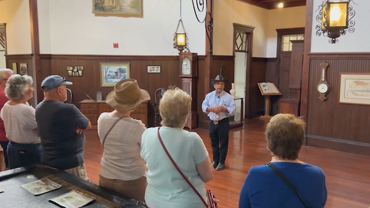 Former Flagler County Commissioner George Hanns leads a tour at Princess Place Preserve. (Spectrum News)