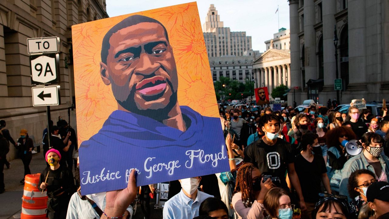 Demonstrators march through lower Manhattan during a rally to remember the murder of George Floyd on Tuesday, May 25, 2021, in New York. (AP Photo/Eduardo Munoz Alvarez)