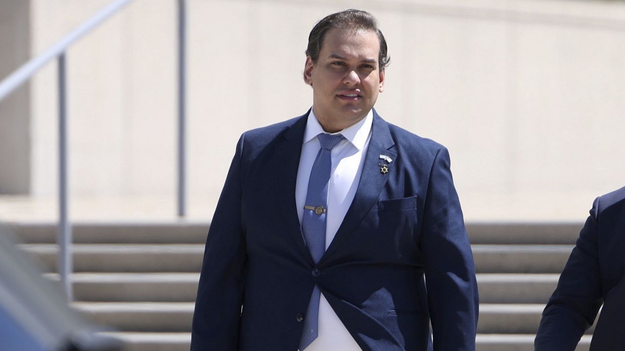 Former U.S. Rep. George Santos leaves federal court following a hearing in is fraud trial, Tuesday, Aug. 13, 2024, in Central Islip, N.Y. (James Carbone/Newsday via AP)