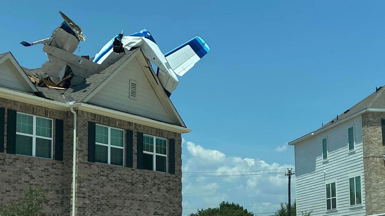A small airplane is lodged in the roof of a duplex in Georgetown, Texas, in this image from July 23, 2023. (Courtesy of Georgetown Fire Department/Facebook)