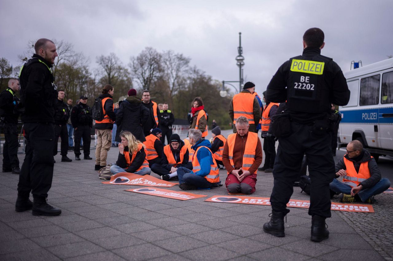 Climate activists stage slow march through German capital