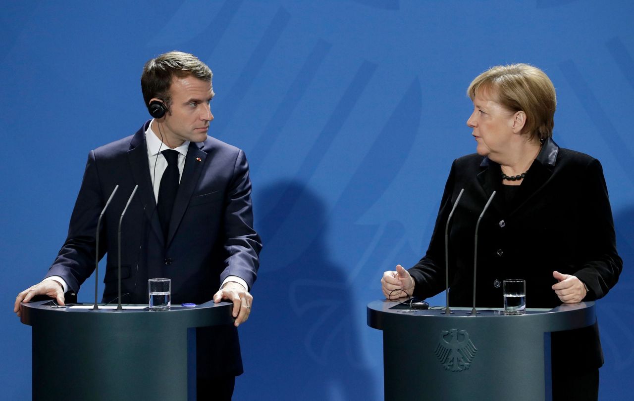 Macron Merkel Seek Common Approaches To Trump Euro