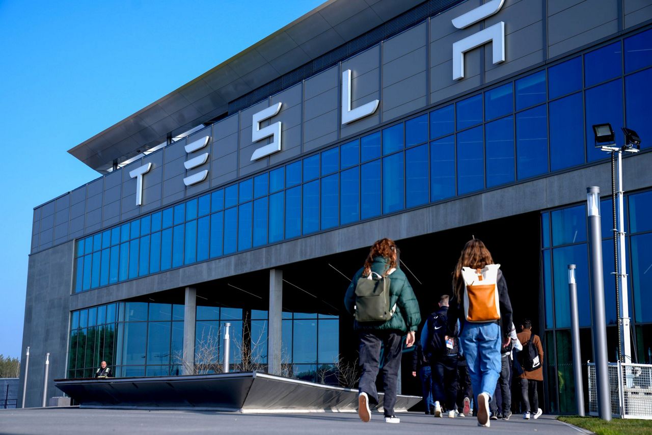 Elon Musk visits a Tesla plant near Berlin as production resumes after ...