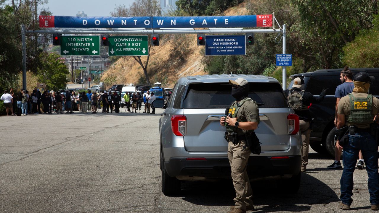 20 June 2025, US, Los Angeles: Border Patrol agents stand at Gate E of Dodger Stadium in Los Angeles. The Dodgers denied them access, stating that immigration agents are not allowed on the property. The agents said no one was detained. Photo: Zin Chiang/dpa (Photo by Zin Chiang/picture alliance via Getty Images)