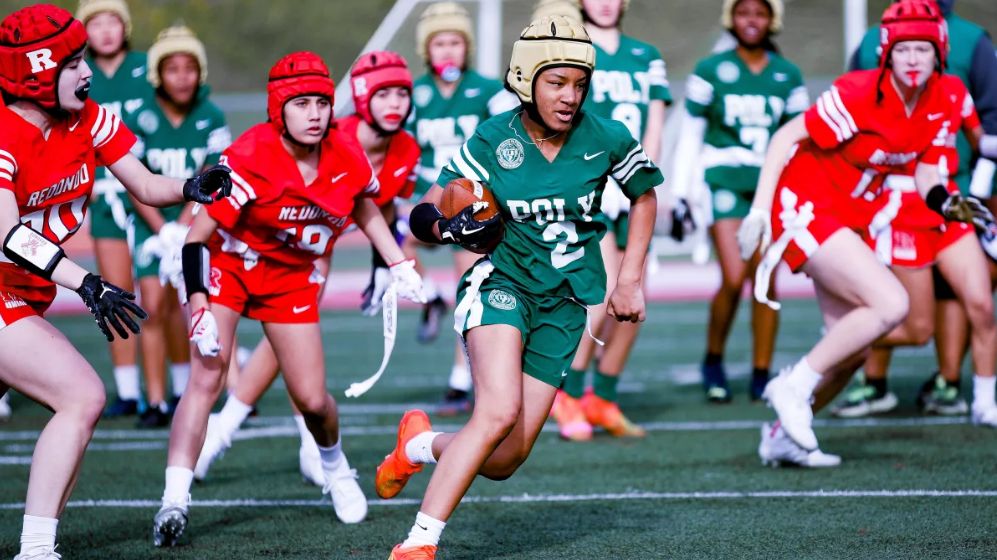 Long Beach Poly High’s Neela Bagley runs for yardage during a League of Champions girls’ flag football game against Redondo Union. (Craig Weston)