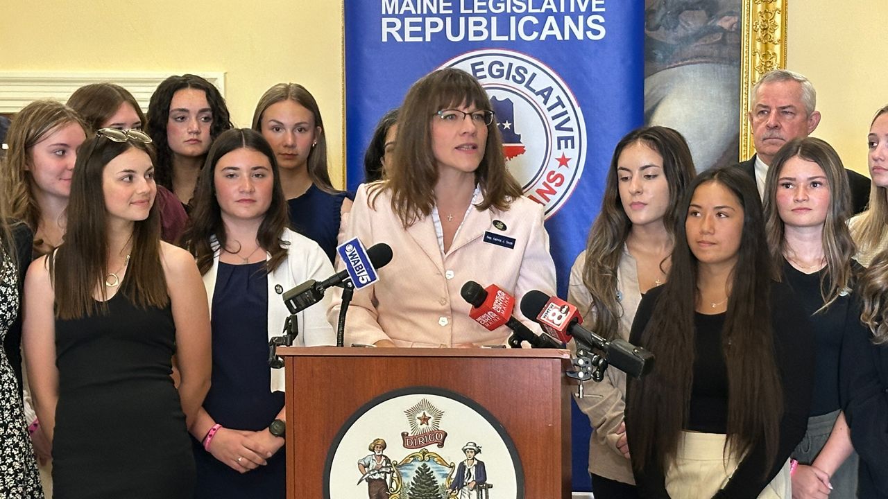 Rep. Katrina Smith (R-Palermo), surrounded by high school athletes, talks about her support for banning transgender girls from girls’ sports teams during a State House news conference. (Spectrum News file photo)