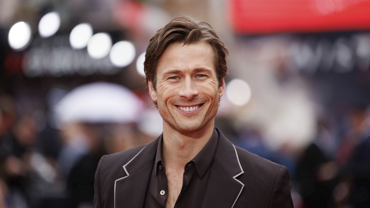 Glen Powell poses for photographers upon arrival at the premiere of the film "Twisters" in London on Monday, July 8, 2024. (Photo by Vianney Le Caer/Invision/AP)