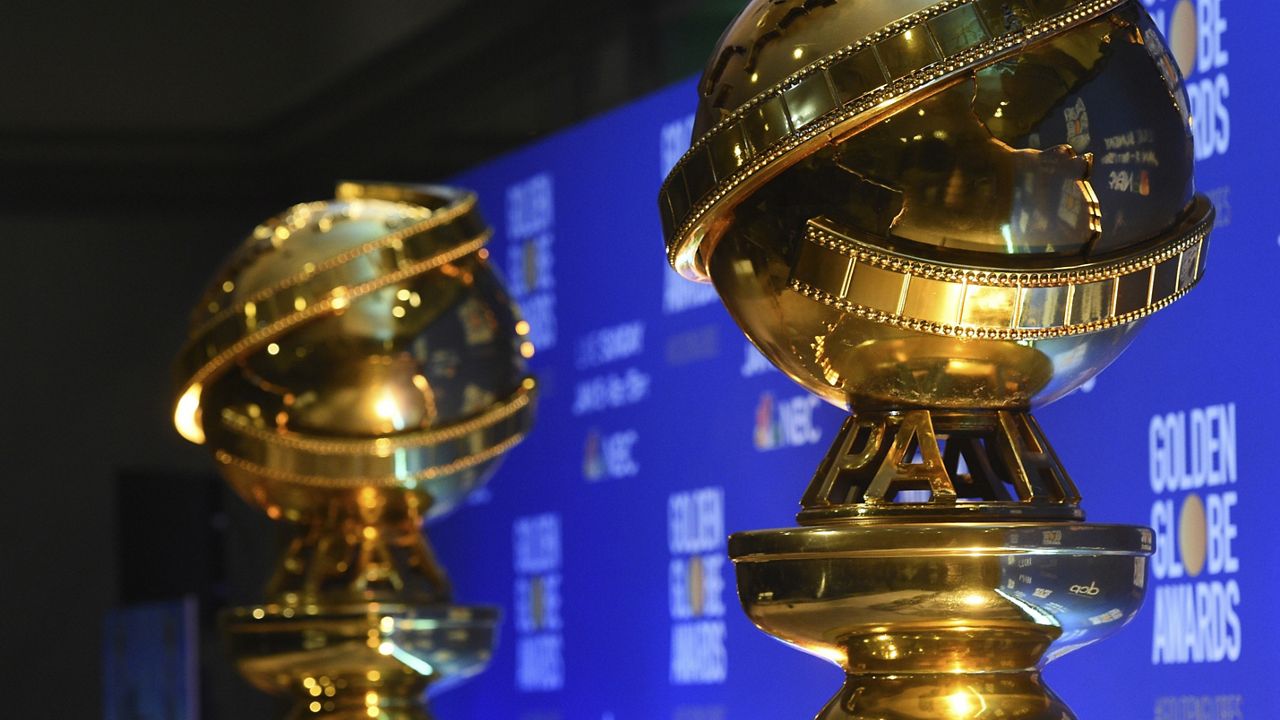 This Dec. 9, 2019 file photo shows replicas of Golden Globe statues in Beverly Hills, Calif. (AP Photo/Chris Pizzello)