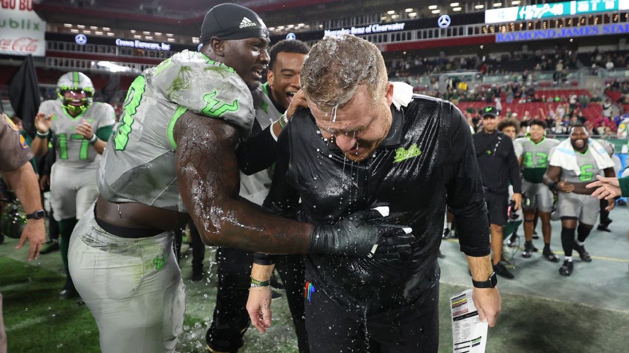 USF Coach Alex Golesh gets a Gatorade bath as part of the celebration after USF's 48-14 win against Charlotte Saturday night. With the win, USF is headed to its first bowl game since the 2018 season (Courtesy @USFFootball) 