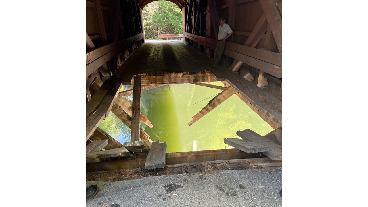 Babbs Bridge, a covered bridge in Gorham on Hurricane Road, now has a gaping hole in its floor, made when a large vehicle fell through it earlier today. Police had no details on the accident, but warned drivers the bridge would be closed until further notice. (Gorham Police Department)