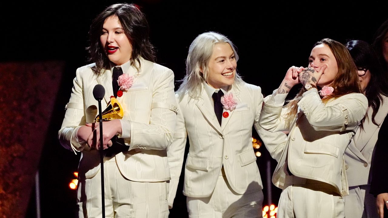 Lucy Dacus, from left, Phoebe Bridgers, Julien Baker, of boygenius accept the award for best rock performance "Not Strong Enough" during the 66th annual Grammy Awards on Sunday, Feb. 4, 2024, in Los Angeles. (AP Photo/Chris Pizzello)