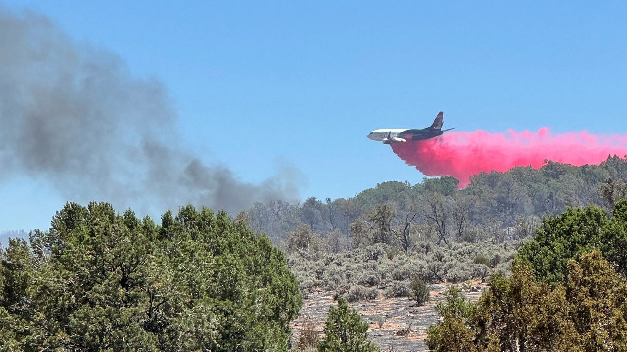 This photo provided by the Bureau of Land Management shows aerial resources working to suppress White Sage wildfire burning north of Grand Canyon National Park in Ariz., on Thursday, July 10, 2025. (Bureau of Land Management, Arizona State Office via AP)