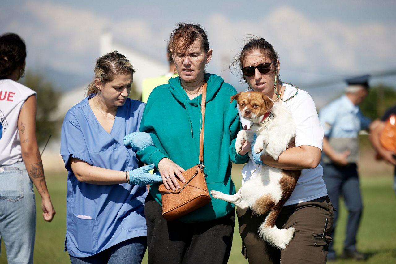 Helicopters airlift residents to safety from deadly floods in central