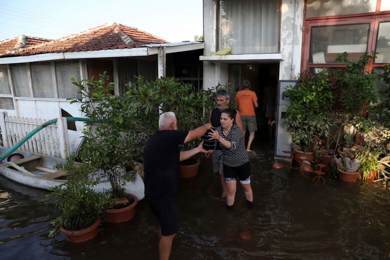 Helicopters airlift residents to safety from deadly floods in central