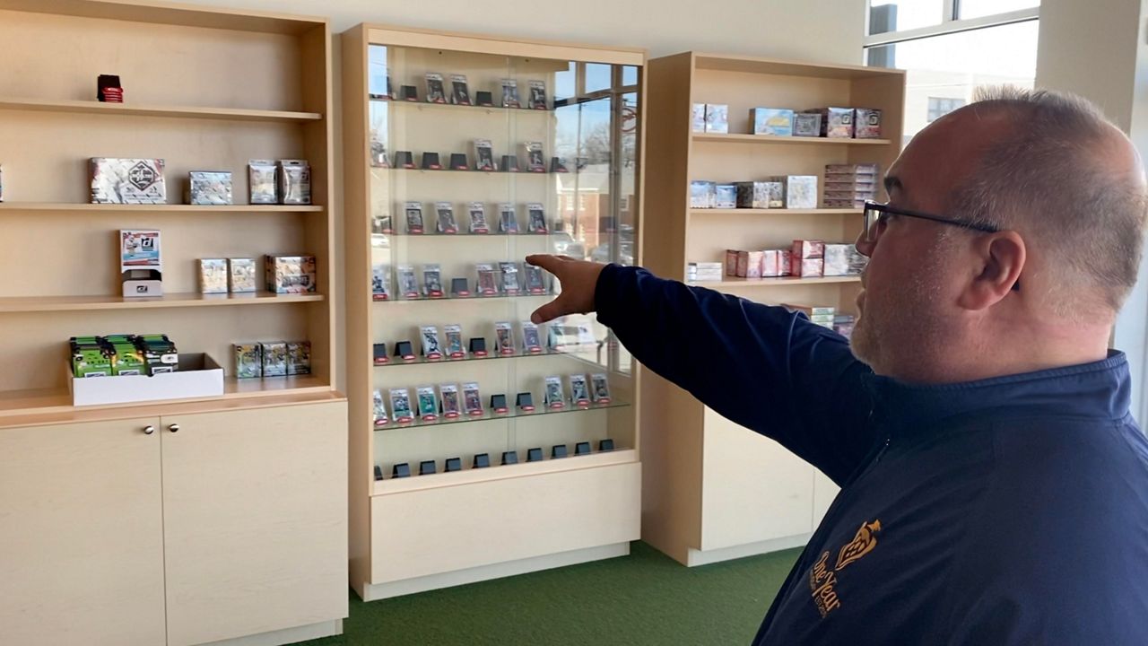 Greg Rouse says he has to restock his supply of sports cards often because of the demand (Spectrum News 1/Sam Knef)