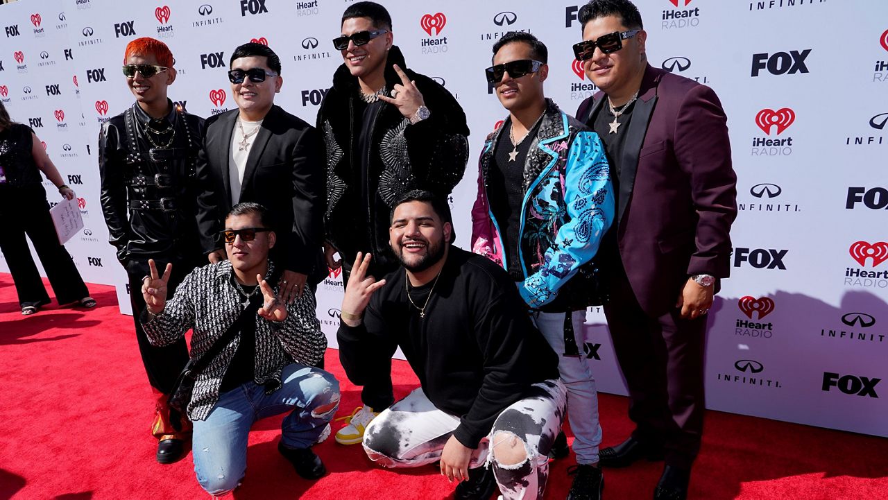 Grupo Firme arrives at the iHeartRadio Music Awards on Monday, March 27, 2023, at the Dolby Theatre in Los Angeles. (AP Photo/Chris Pizzello)