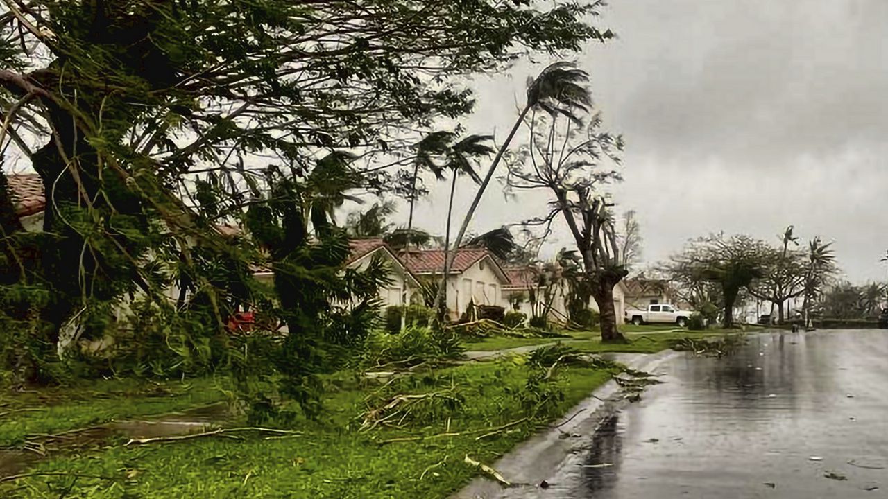 Downed tree branches litter a neighborhood in Yona, Guam, Thursday, May 25, 2023, after Typhoon Mawar passed over the island. (Chief Warrant Officer Adam Brown/U.S. Coast Guard via AP)