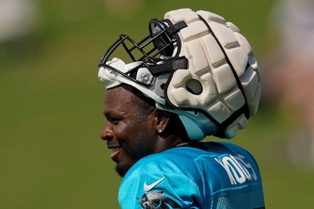 NFL players don Guardian Caps, designed to protect from concussion
