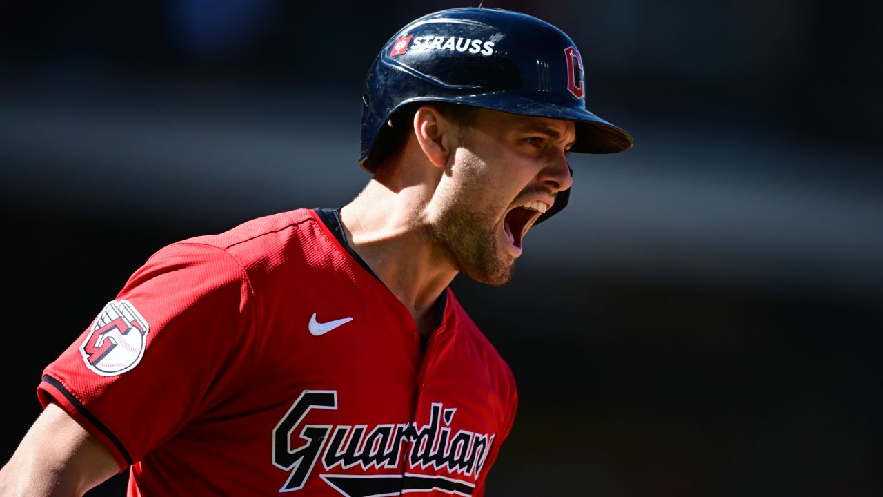 Cleveland Guardians' Lane Thomas shouts as he runs the bases after hitting a home run in the first inning during Game 1 of baseball's AL Division Series against the Detroit Tigers, Saturday, Oct. 5, 2024, in Cleveland.