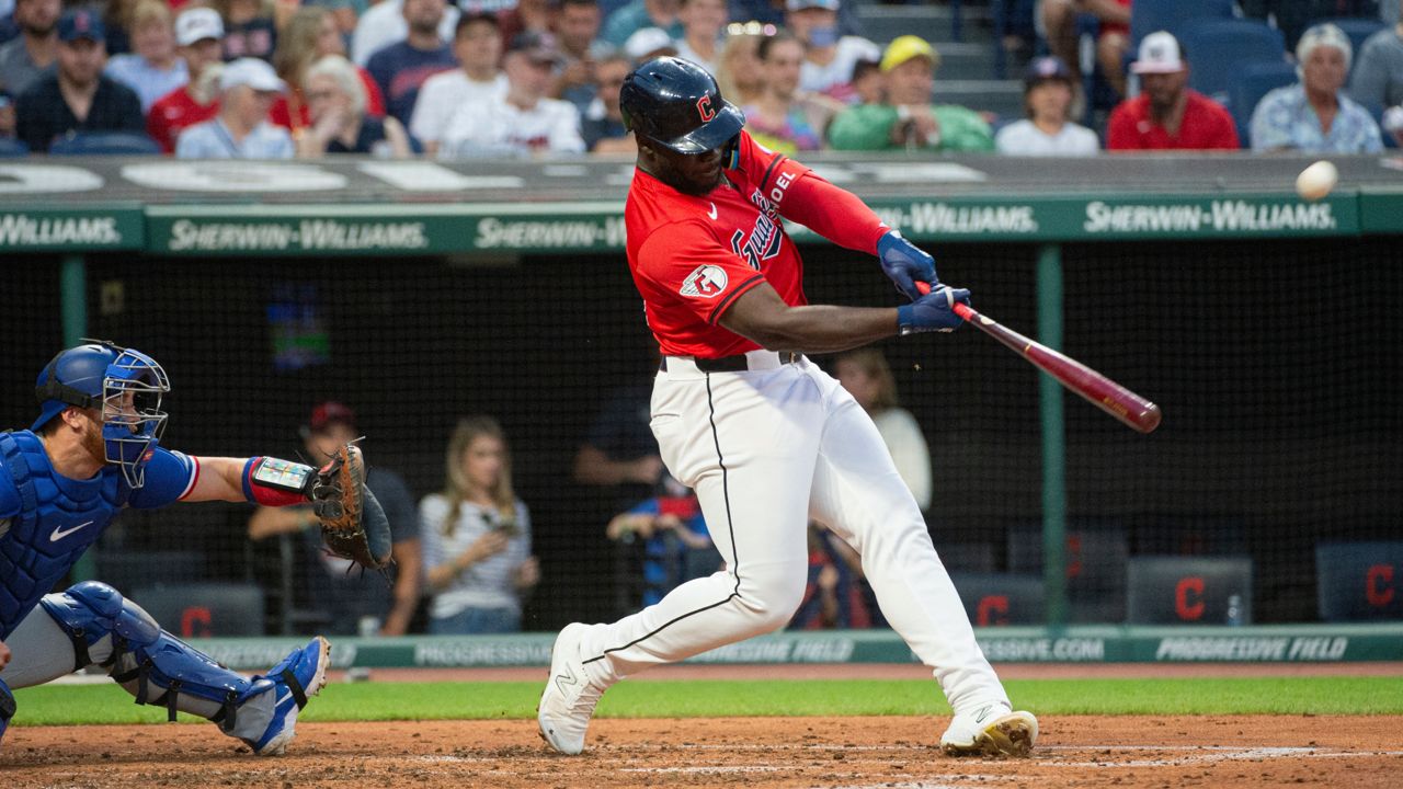 Cleveland Guardians' Jhonkensy Noel, right, watches his three-run home run off Texas Rangers starting pitcher Jon Gray as Carson Kelly, left, looks on during the third inning of a baseball game in Cleveland, Saturday, Aug. 24, 2024.