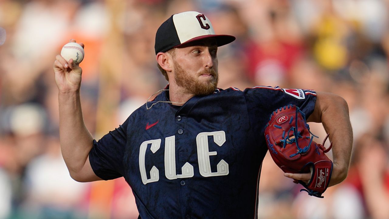 Cleveland Guardians' Tanner Bibee pitches in the first inning of a baseball game against the San Francisco Giants, Friday, July 5, 2024, in Cleveland. (AP Photo/Sue Ogrocki)