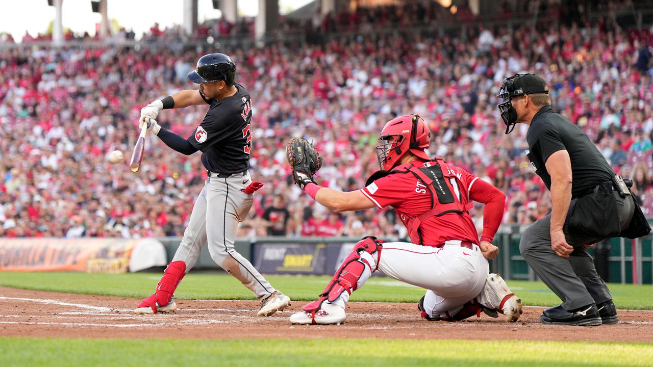 Cleveland Guardians' Steven Kwan hits a two-run double against the Cincinnati Reds during the third inning of a baseball game in Cincinnati, Tuesday, June 11, 2024. (AP Photo/Jeff Dean)