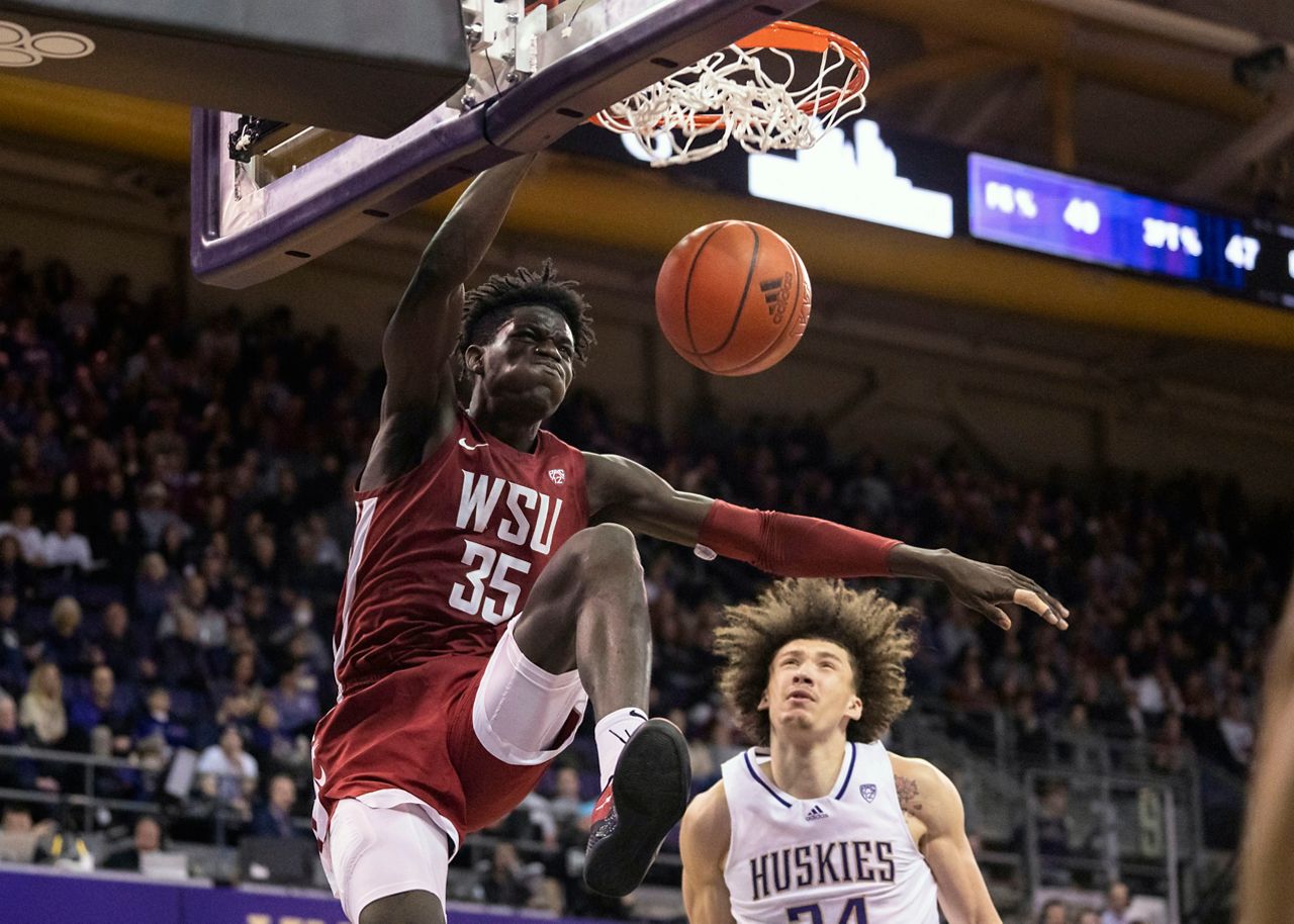 FILE - Washington State's Mouhamed Gueye (35) dunks against Washington center Braxton Meah during the second half of an NCAA college basketball game March 2, 2023, in Seattle. The Atlanta Hawks have confirmed an agreement to acquire the draft rights to Gueye from the Boston Celtics in exchange for a future second-round pick. The Celtics drafted Gueye with the No. 39 overall pick of the NBA draft Thursday, June 22, 2023. (AP Photo/Stephen Brashear, File)