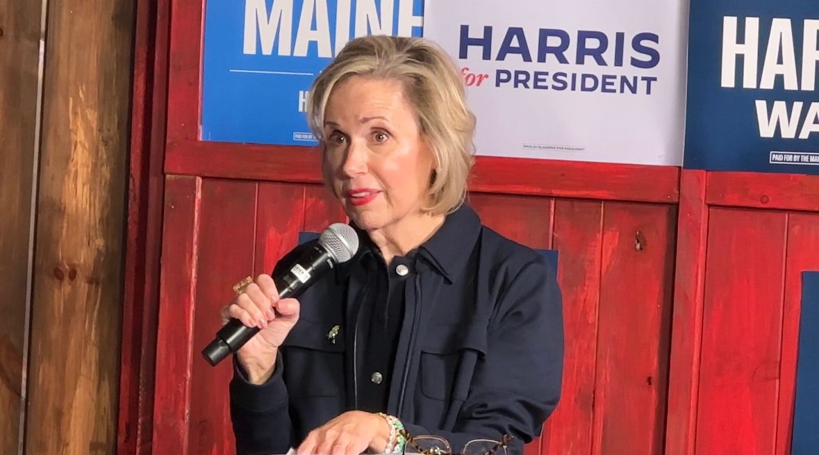 Gwen Walz, wife of Democratic vice-presidential nominee Tim Walz, talks to supporters in Bangor on Friday. (Spectrum News/Susan Cover)