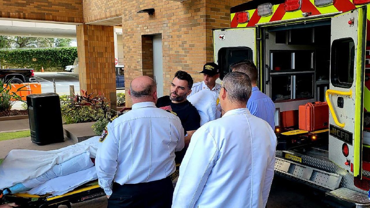 Hillsborough County Sheriff's Cpl. Carlos Brito (center) was transferred Monday from TGH to a local rehab facility to continue his recovery from a serious leg injury. (Courtesy Tampa general Hospital)