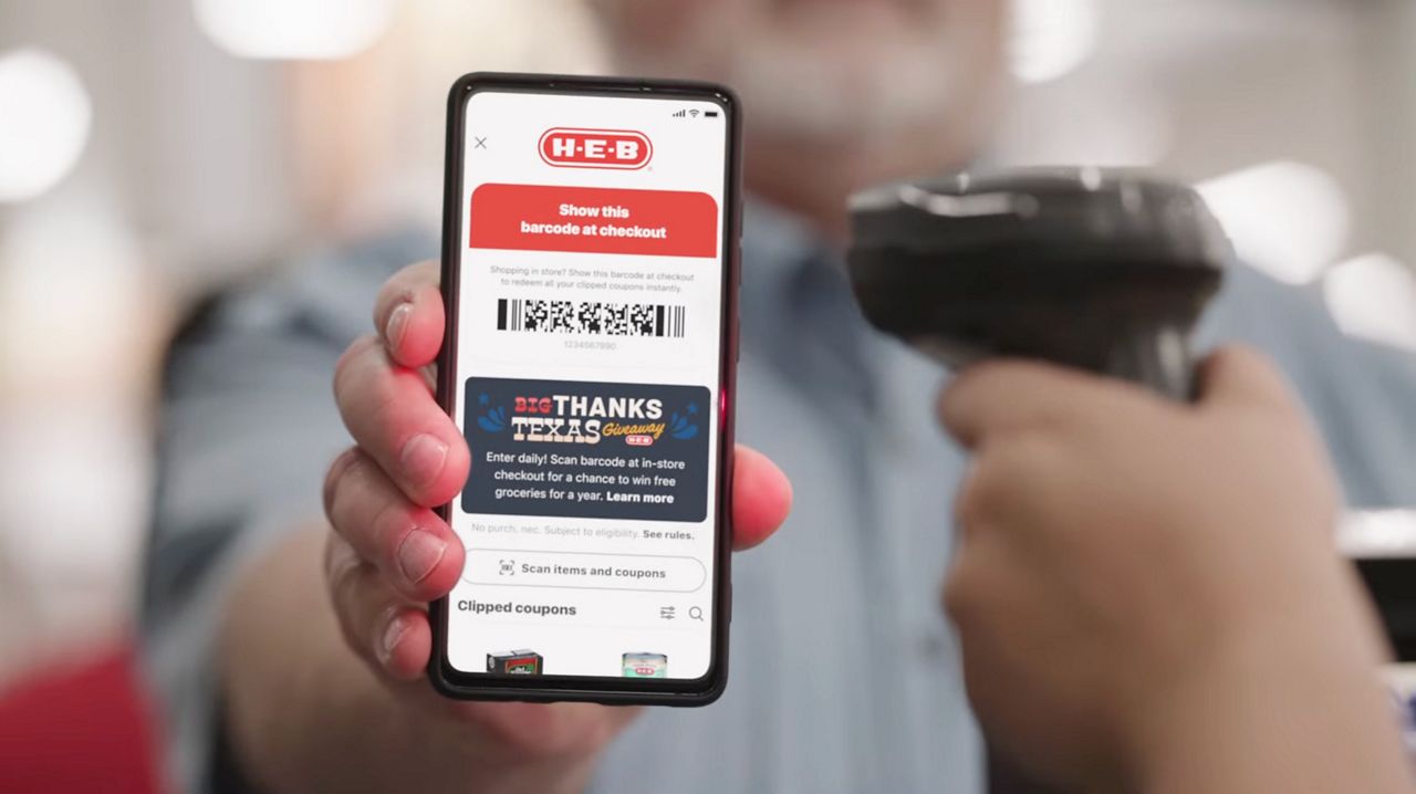 A team member scans a customer's barcode in the My H-E-B App. (Credit: H-E-B)