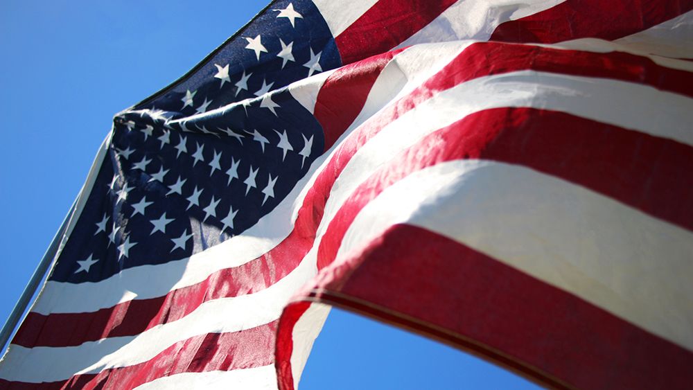 American flag blowing in the wind. (Getty Images)