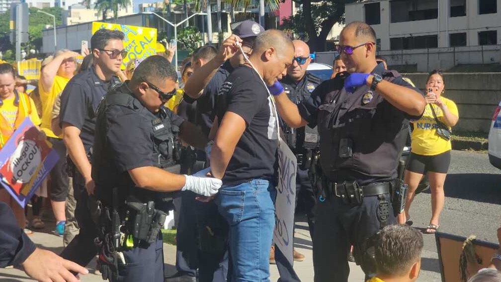 Ten people were arrested for blocking a bus carrying replacement travel nurses during a demonstration outside Kapiolani Medical Center for Women and Children on Sept. 23, 2024. (Photo courtesy of Hawaii Nurses Association)