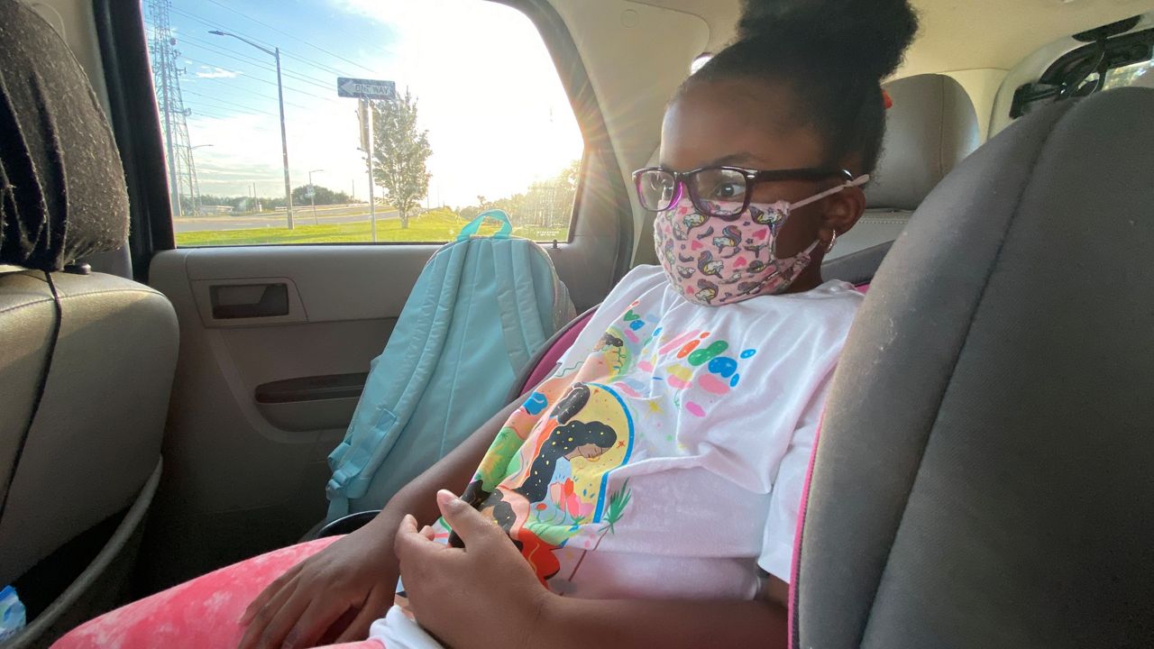 Jan Bailey-Smith's daughter, Ce’Naeyah, 6, rides home from school with her grandmother (Spectrum News/Molly Duerig)