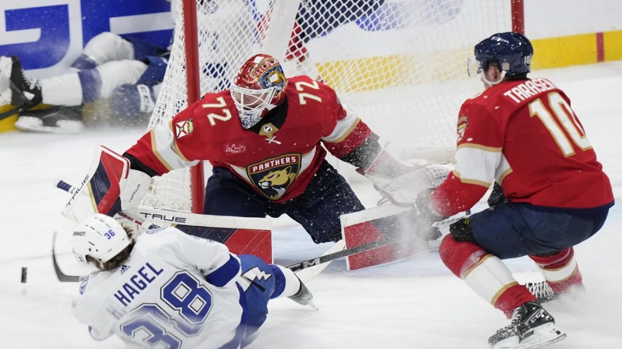 Tampa Bay Lightning left wing Brandon Hagel (38) attempts a shot as he slides into Florida Panthers goalie Sergei Bobrovsky (72) during the second period of Game 2 Tuesday night in Florida's 3-2 OT win. (AP Photo/Wilfredo Lee)