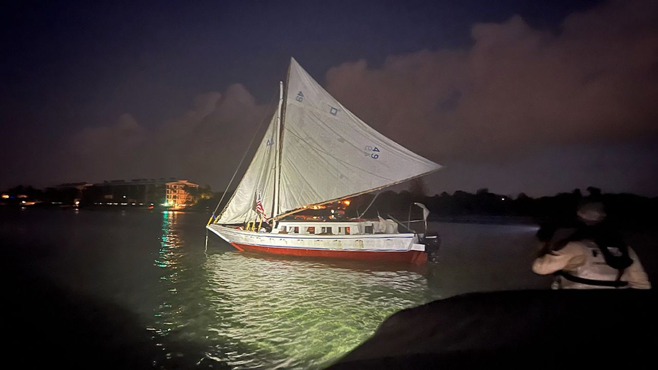 In this photo provided by the Monroe County Sheriff's Office, a sailboat carrying a group of over 100 migrants from Haiti is shown after they arrived off Key West, Fla., early Wednesday, June, 26, 2024. (Monroe County Sheriff's Office via AP)