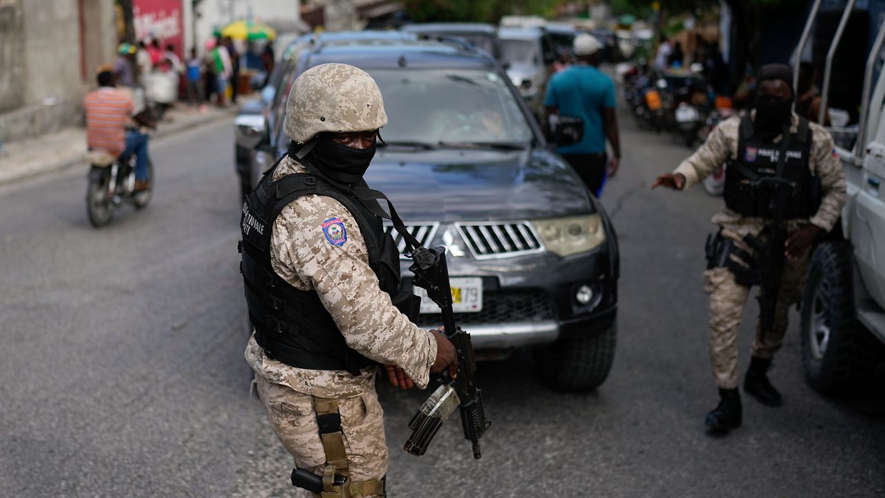 Soldiers deploy outside the prime minister's office in Port-au-Prince, Haiti, in preparation for the swearing-in of a transitional council tasked with selecting a new prime minister and cabinet, Thursday, April 25, 2024. (AP Photo/Ramon Espinosa)