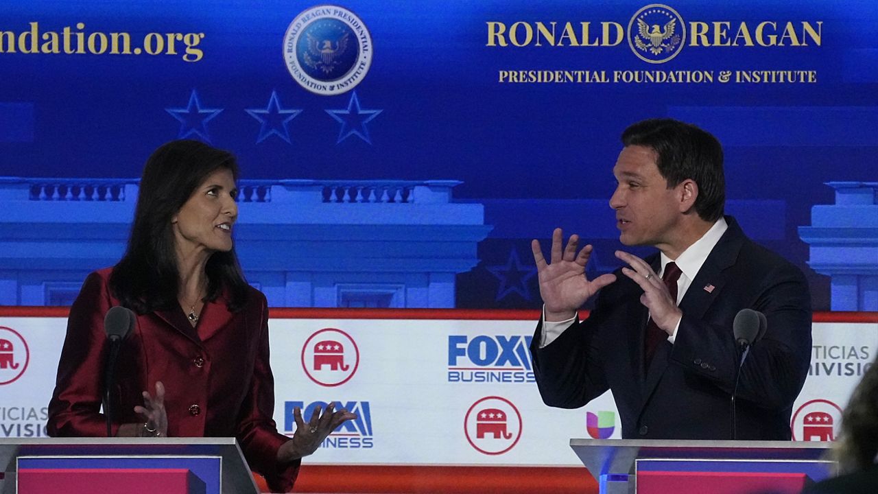 Former U.N. Ambassador Nikki Haley, left, argues a point with Florida Gov. Ron DeSantis during a Republican presidential primary debate hosted by FOX Business Network and Univision, Wednesday, Sept. 27, 2023, at the Ronald Reagan Presidential Library in Simi Valley, Calif. (AP Photo/Mark J. Terrill)