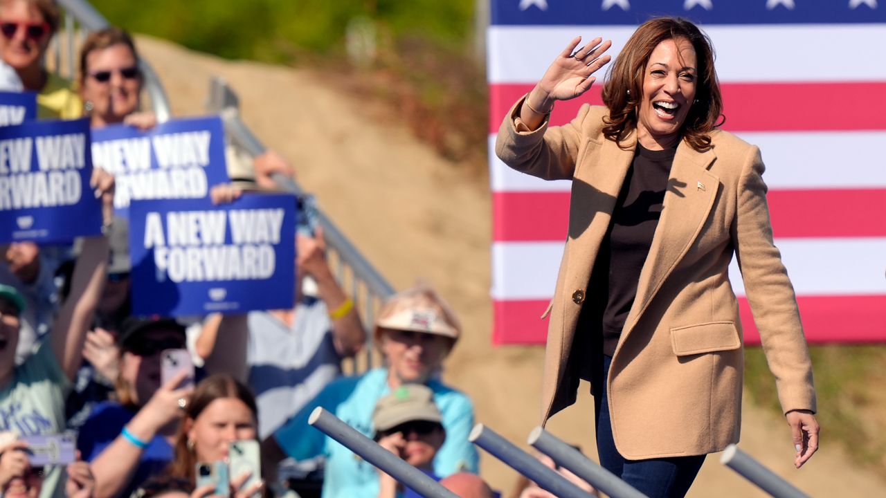 Democratic presidential nominee Vice President Kamala Harris waves as she steps on stage to address a crowd, Wednesday, Sept. 4, 2024, during a campaign stop, in North Hampton, N.H. (AP Photo/Steven Senne)