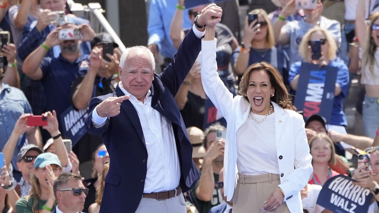 Democratic presidential nominee Vice President Kamala Harris is welcomed by Democratic vice presidential nominee Minnesota Gov. Tim Walz, before she delivers remarks at a campaign event, Wednesday, Aug. 7, 2024, in Eau Claire, Wisc. (AP Photo/Charles Rex Arbogast)