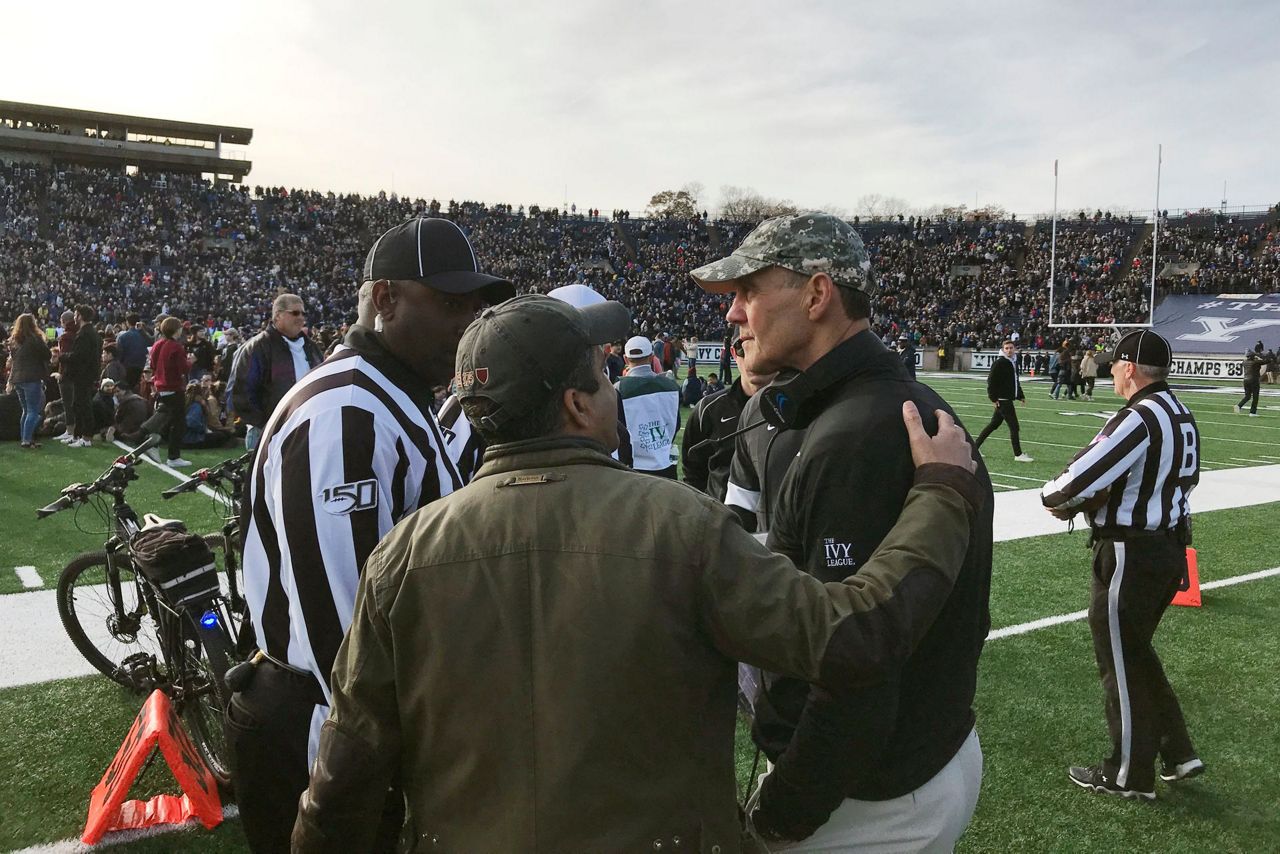 Students storm field at halftime of Harvard-Yale to protest