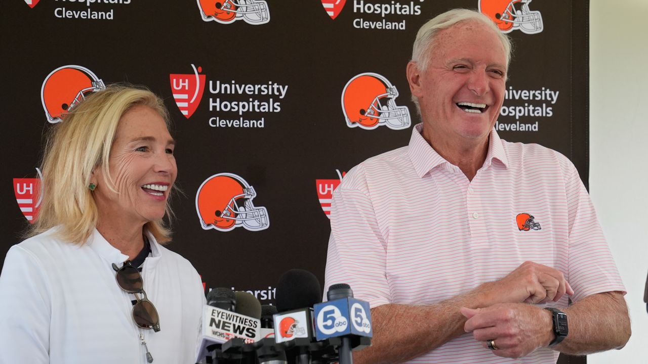 Cleveland Browns owners Dee and Jimmy Haslam laugh during a news conference at an NFL football training camp practice, Saturday, July 27, 2024, in White Sulphur Springs, W.Va.