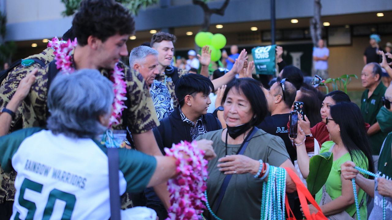Fans mingled with the Hawaii men's volleyball team as the Rainbow Warriors made their way to the team bus at the back entrance of the Stan Sheriff Center on Sunday night. UH is bound for Columbus, Ohio, for the NCAA Tournament.