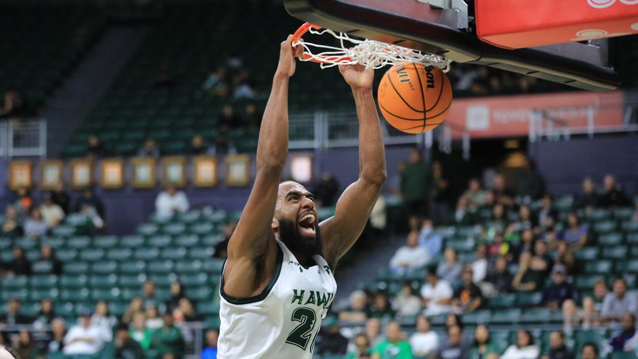 Hawaii forward Jerome Palm, a transfer from Valparaiso, dunked the ball in the second half of the 2024-25 season opener against Life Pacific at the Stan Sheriff Center on Friday night.