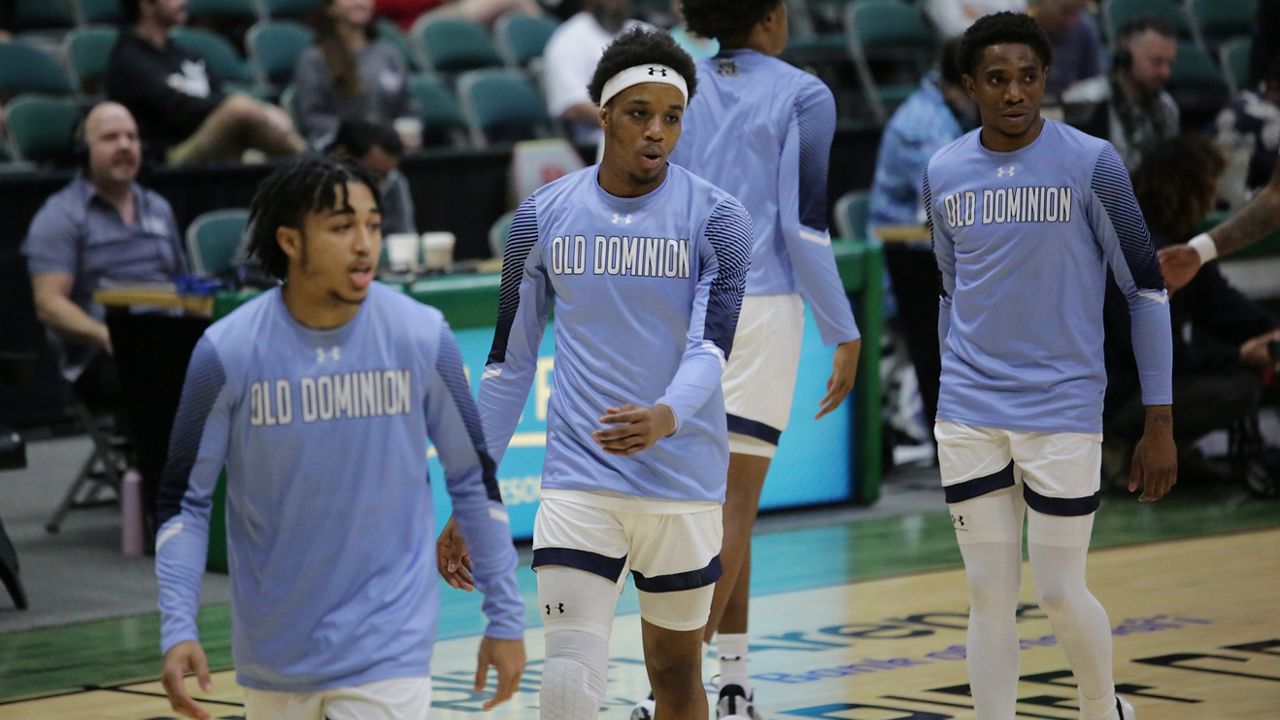 Old Dominion University men's basketball players warmed up for their game against TCU in the Hawaiian Airlines Diamond Head Classic first round at the Stan Sheriff Center on Thursday. ODU's head coach, Jeff Jones, was recovering in a hospital from a heart attack he suffered Wednesday evening.