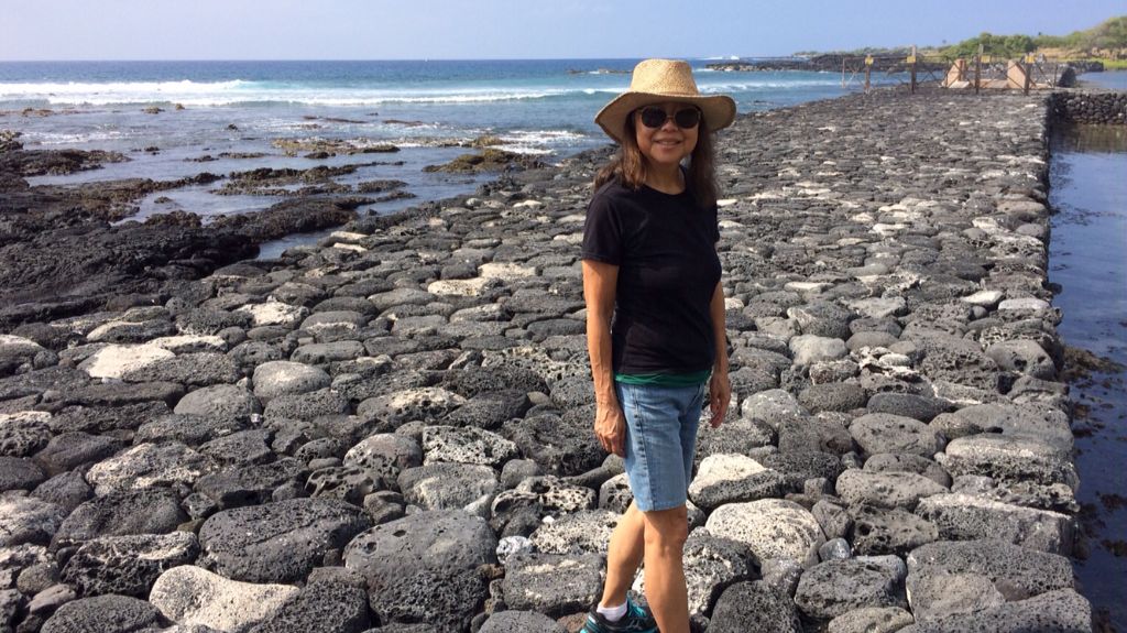 Carol Araki Wyban walks on Kaloko Fishpond in 2005 after the wall was restored. Kaloko Fishpond is the largest fishpond in the state.  (Photo courtesy of the University of Hawaii)